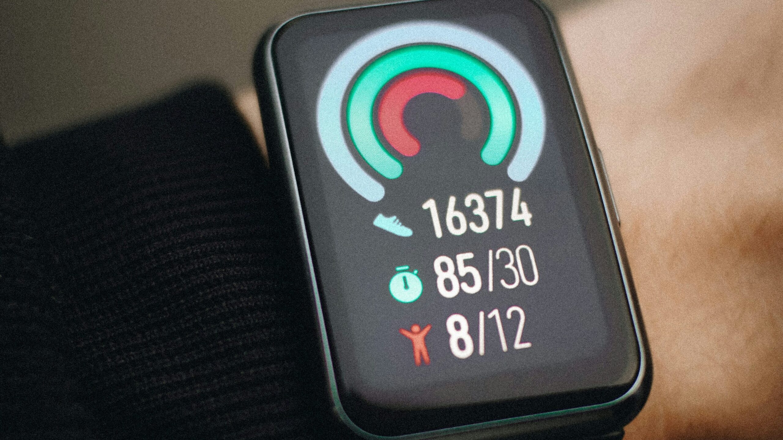 Close-up of a smartwatch on a wrist displaying fitness metrics.